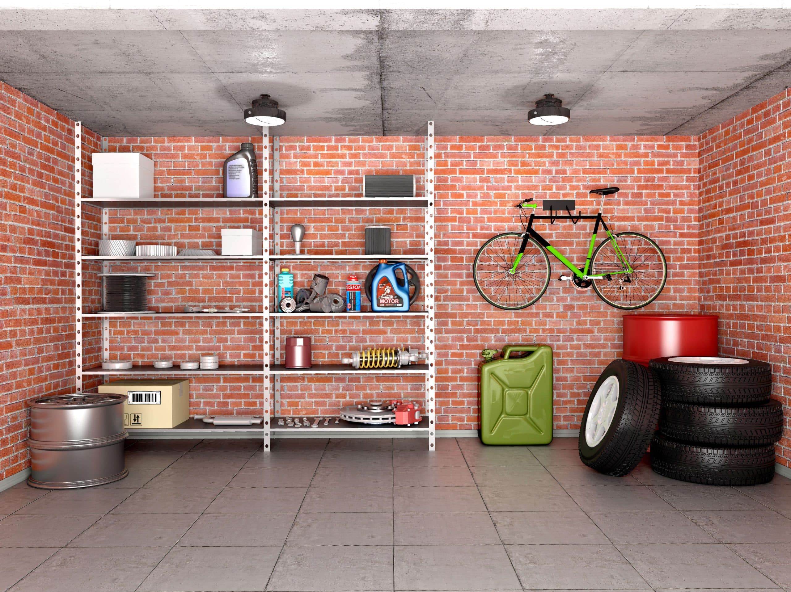 Uporządkowane wnętrze garażu z ułożonymi oponami, zawieszonym rowerem oraz narzędziami i środkami czystości na regale